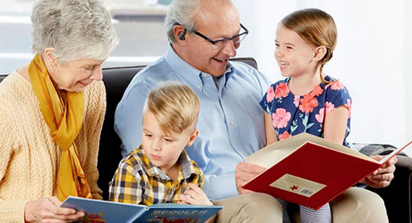 grandparents reading to their grandchildren